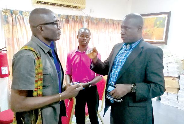 Prof. Francis Owusu-Mensah (right ) interacting with the media at the workshop