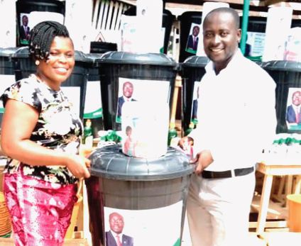  Mr Alex Andoh (right), the Constituency Communication Officer, making a presentation to Madam Evelyn Gormon, Assembly member for Ajumako Besease Electoral Area