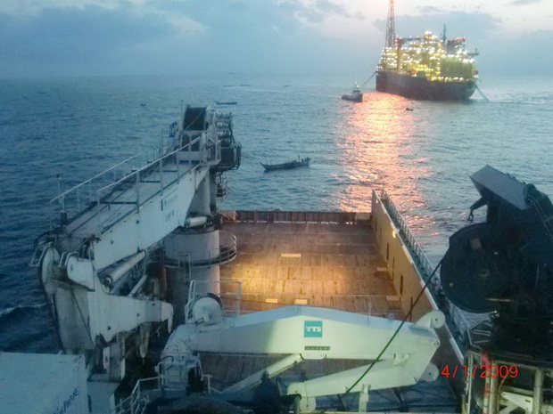Canoes invading offshore oil fields, transporting passengers