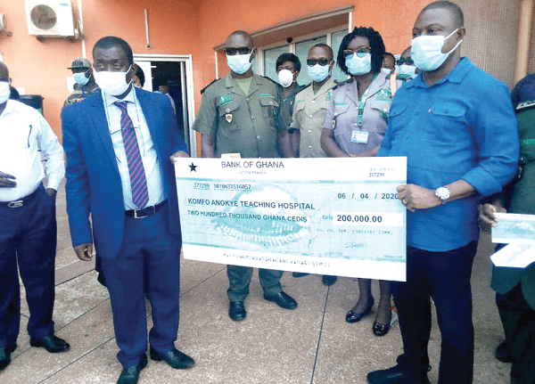 Mr John Allotey (right), presenting the dummy cheque to Dr Oheneba Danso