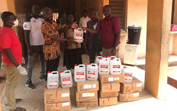  Mr Andani ( left), Area Manager in-charge of Northern Ghana, Kinapharma Limited presenting the items to Mr Dery, ( right), head of Pharmacy , Walewale Government Hospital. In the middle is Murtala Tawfique, Internal auditor of the hospital.