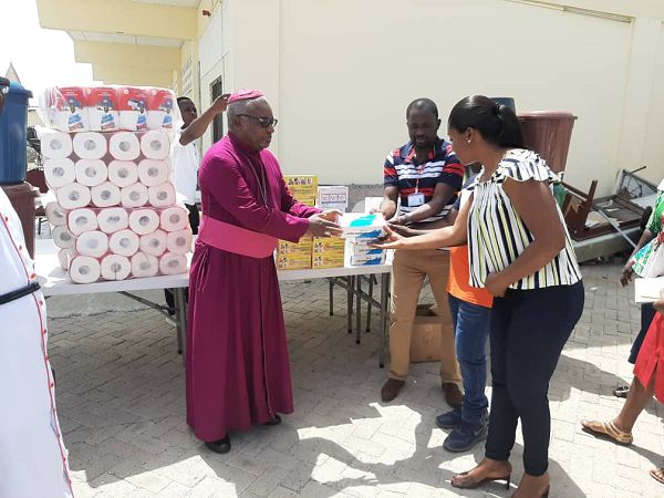 Rt Rev Dr Victor Reginald Atta-Baffoe(left) making a presentation to some members of the Central Regional Logistics Mobilization Committee for COVID-19.