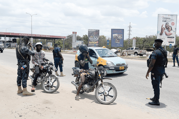 Police personnel maning a check point