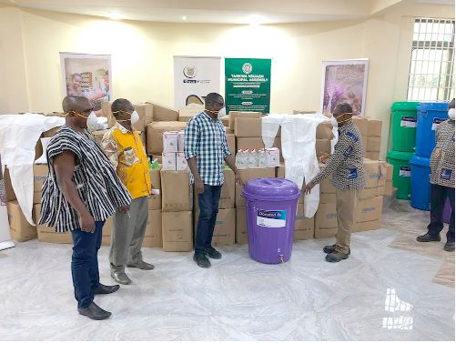 Mr Stephen Osei-Bempah (right) presenting the items to  Mr G. K. Asmah 