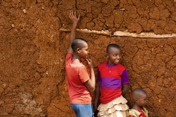 Children behind a house in Ghana