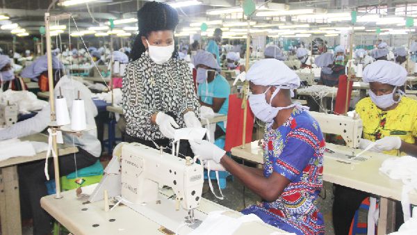 Nora Bannerman (left)  supervising her workers in the production of the nose masks. Picture: EDNA SALVO-KOTEY