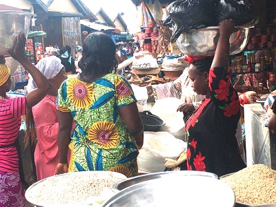 Some residents buying gari at the Bantama Market in Kumasi.