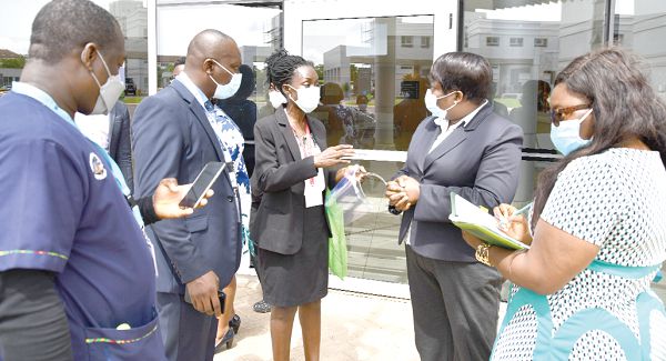  Dr Godfred Takyi (left), Dr Kwame Anim-Boamah (2nd left), Director, Medical Services, and Mrs Judith Asiamah (2nd right), Director of Nursing  of University of Ghana Medical Centre, briefing Daily Graphic’s Rosalind K. Amoh (middle) and Doreen Andoh (right). Picture: EBOW HANSON 