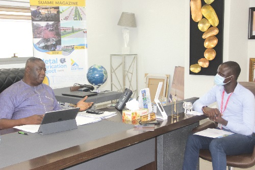 Mr Lawrence Agyinsam (left), talking to Mr Timothy Ngnenbe, a reporter with the Daily Graphic. Picture: EDNA SALVO-KOTEY
