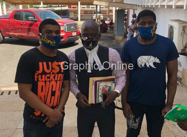 The two accused persons who were set free - Samuel Plange (left) and Issah Alhassan (right) with their lawyer, Mr Andrew Vortia
