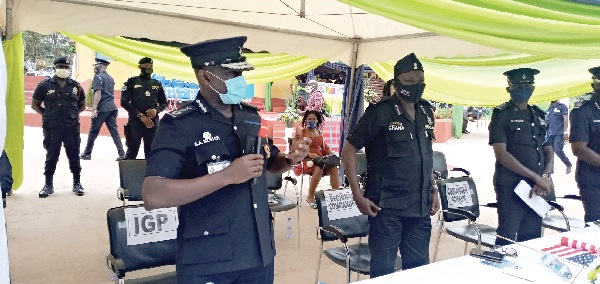 COP George Mensah (left) addressing the function