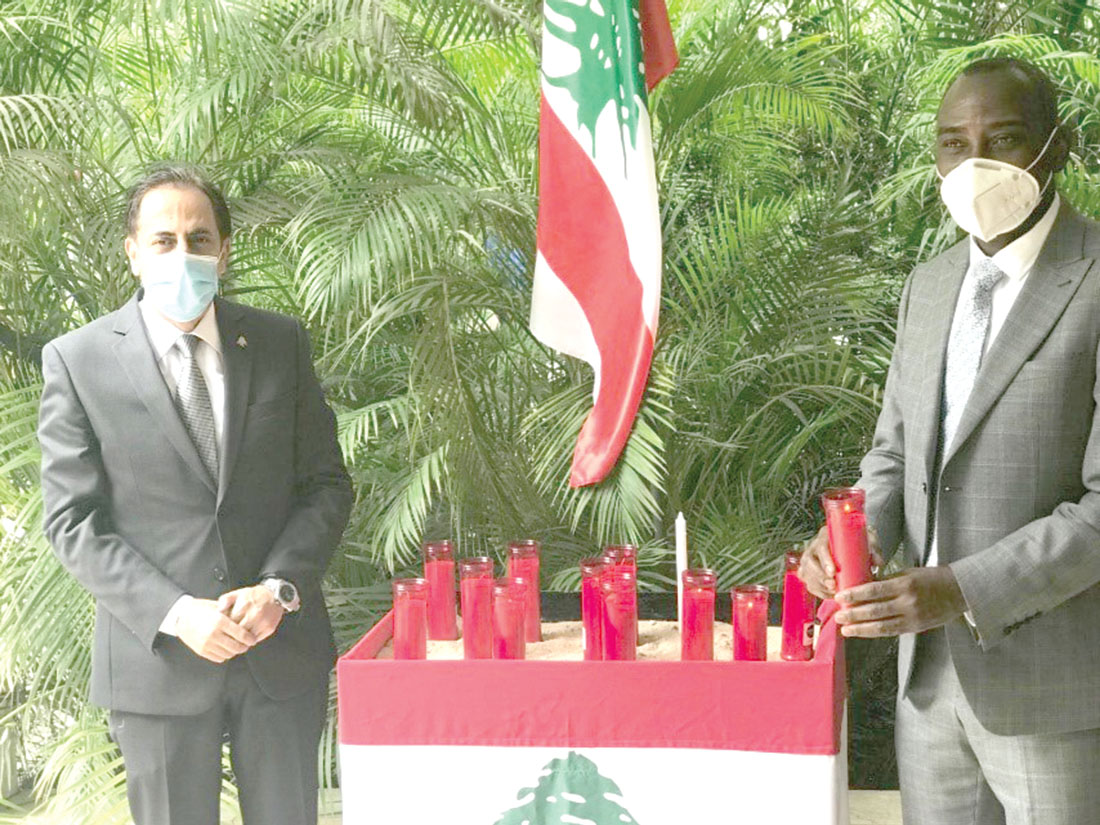 Prof.  Kwamena Kwansah-Aidoo (right) and Mr Maher Kheir, the Lebanese Ambassador to Ghana, with the sympathy candles