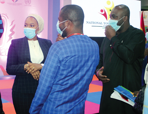 Mrs Samira Bawumia (left), the wife of the Vice-President,  Mr Isaac Asiamah (right), Minister of Youth and Sports, and Mr Sylvester Mensah Tetteh (back to camera), Chief Executive Officer of the National Youth Authority, interacting at the International Youth Day celebration in Accra. Picture: GABRIEL AHIABOR
