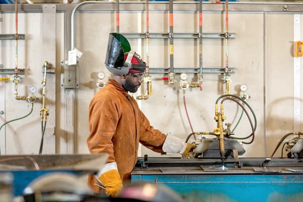 Abdul Rahaman Dayankrah busy on a welding machine  