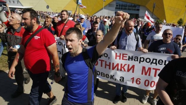 Striking workers gathered outside the Minsk tractor factory on Monday