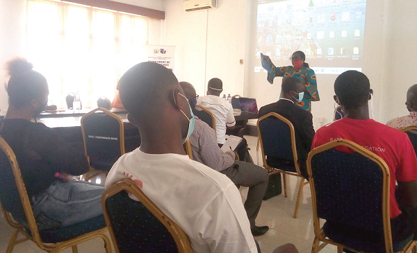  Mrs Thywill Eyra Kpe making a presentation at the workshop