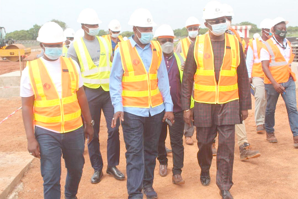 Mr Kofi Adda, Aviation Minister (2nd right), with Mr Saeed, the Northern Regional Minister (middle) inspecting the project