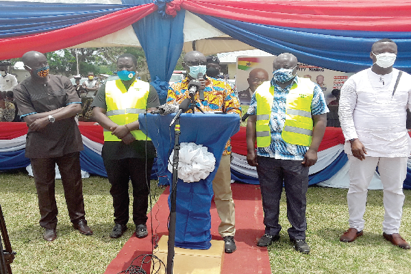 Mr Kwaku Asomah-Cheremeh (middle) with the DCEs from the beneficiary districts