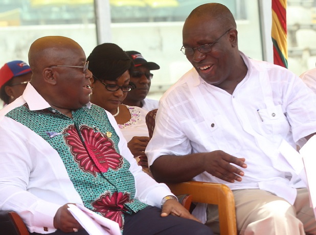 President Akufo-Addo listening to Dr. Yaw Baah, TUC Secretary General during a May Day celebration 