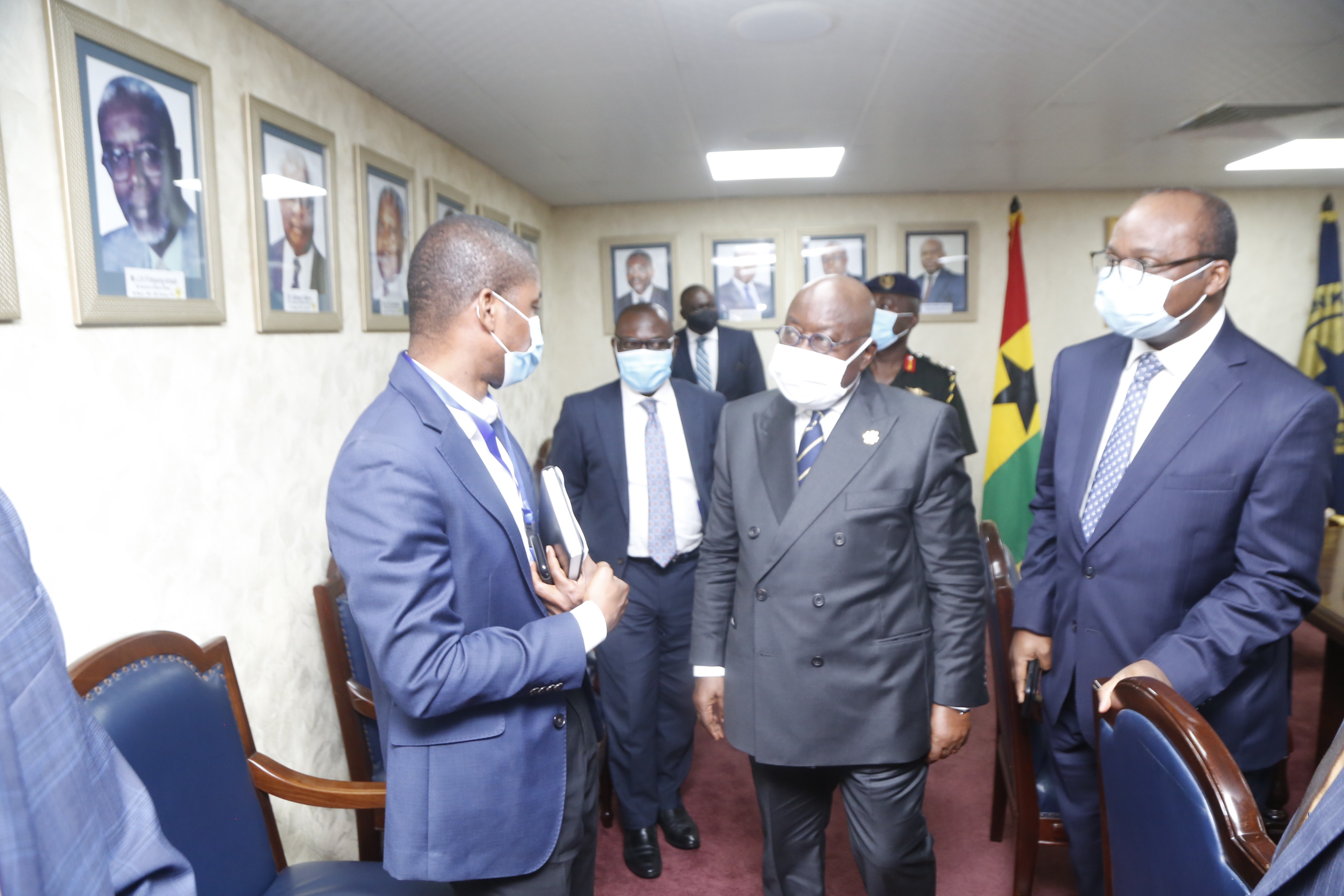 President Akufo-Addo engages an official of the BoG, while Dr Ernest Addison (right), the Governor, looks on. Picture: SAMUEL TEI ADANO