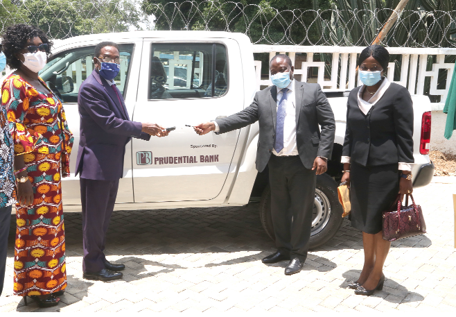 Mr Thomas Broni (2nd right), Executive Head, Operations, Prudential Bank Limited (PBL), handing over keys to the double-cabin pickup to Prof. Kwesi Yankah (2nd left), as Mrs Gifty Twum Ampofo (left), a Deputy Minister of Education, and Mrs Akosua Boahen (right), Head of Marketing & Corporate Affairs, PBL look, on. Picture: NII MARTEY M. BOTCHWAY