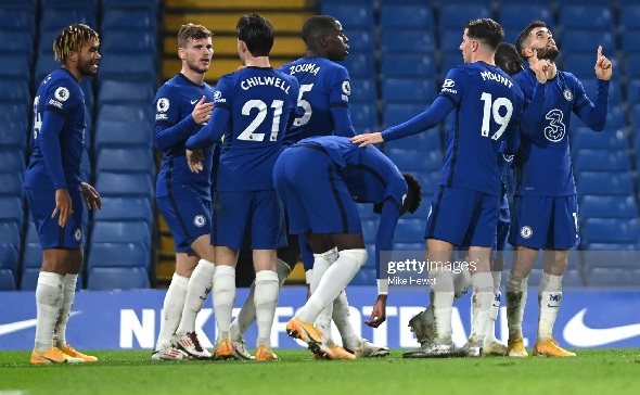 Chelsea players celebrating a goal against Leeds United