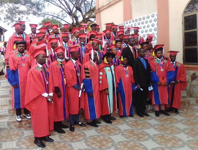 Some graduates in a group photograph after the graduation.