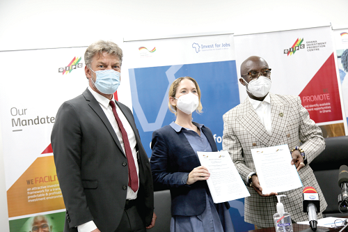 Ms Dorothee Dinkelaker (middle), Head of Development Cooperation, German Embassy, and Mr Yofi Grant (right), the Chief Executive Officer of the Ghana Investment Promotion Centre, displaying the signed documents. With them is Mr Gerald Guskowski (left), Head of the GIZ Country Programme. Picture: GABRIEL AHIABOR