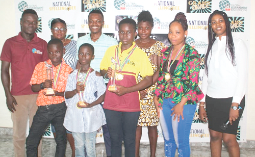 The winners with their trophies and the organisers. First row from right: Princess Wiafe of Ho Henry House International School, Marvelous Woedem Tokpo of the same school, and Ewurabena Oye Quaye of Akosombo Crorireche International School