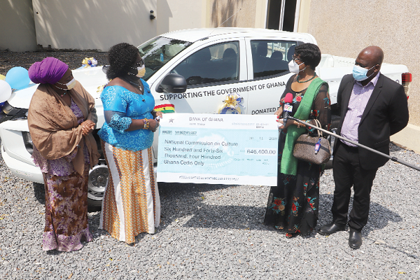 Justice Sophia Akuffo (right), Chairperson, National COVID-19 Trust Fund, presenting a dummy cheque to Mrs Elizabeth Nyame (2nd left), Executive Director, National Commission on Culture. Picture: SAMUEL TEI ADANO 