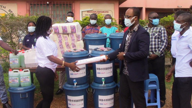 Ms Gifty Ahwireng (left), Project Lead of Semada Foundation making a presentation to Mr. Joseph Korsah, Nutrition Officer for the Abura Asebu Kwamankese District.