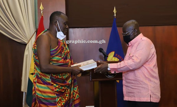 President Akufo-Addo receiving the report from Nana Otuo Siriboe II, the Chairman of the Council of State at the Jubilee House. Picture: Samuel Tei Adano