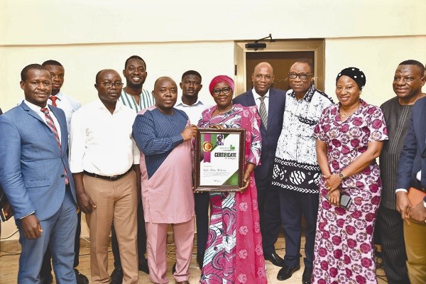 Hajia Alima Mahama (middle) displaying her citation. On her left is Chief Akilu Sayibu. Picture EBOW HANSON