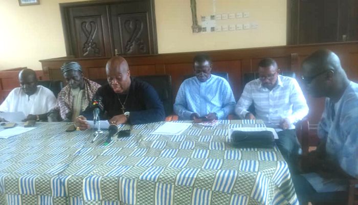Osofo Nii Naate Atswele Agbo Nartey (middle) flanked by other leading members of the group making his presentation at the press conference