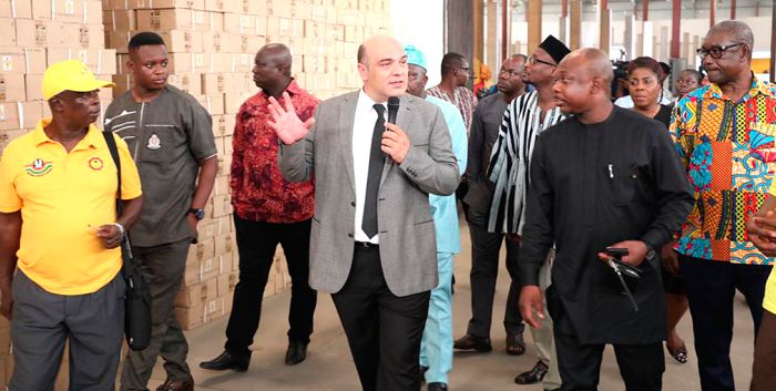 Mr Akif Cogoit, Managing Director of Dumgya Project conducting the members of the Parliamentary Select Committee on Defence and Interior round the fire extinguishers loaded at the warehouses
