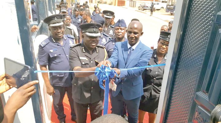  Mr Francis Kwesi Nyankson (2nd right) assisting Mr Frederick Adu Anim (2nd left) to cut a tape to officially open the apartment.