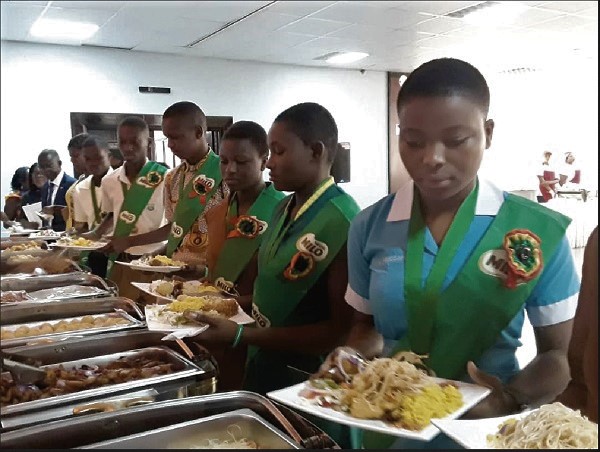 The awardees taking their turn to be served