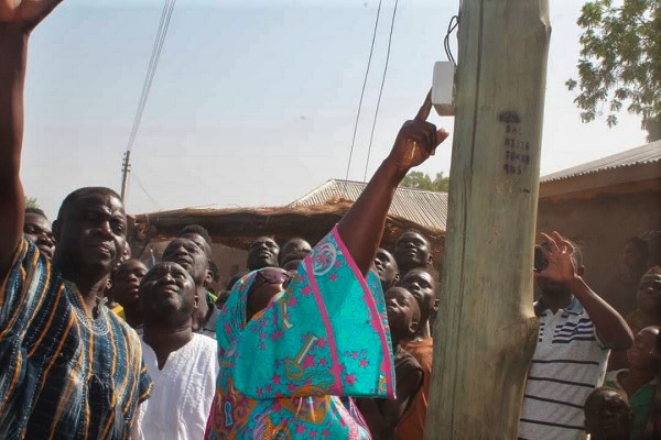 Hajia Mahama switching on the light for the Tunni community