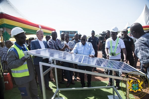 President Akufo-Addo inspecting a solar panel. With him are officials of the VRA 
