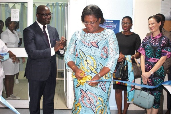 Mrs Janet Tamaklo (3rd right) Emeritus Chair of the Nyaho Medical Centre cutting the tape to inaugurate the new facility in Accra. Those with her include Mr Emmanuel Agyei (left), Operations Director of the hospital and other officials
