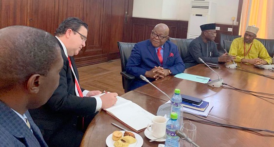 Mr Pierre Frank Laporte (left) signing the visitors’ book when he paid a courtesy call on the Speaker, Prof. Mike Oquaye (2nd left). Also in the picture are Mr Osei Kyei-Mensah-Bonsu (2nd right), Majority Leader, and Mr Mohammed-Mubarak Muntaka (right), the Minority Chief Whip