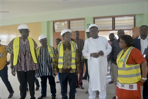 Rev. Fr Prof. Anthony Afful 	(2nd right) making a point to Prof. Kwesi Yankiah  during the inspection while  Prof. Andrew Ofori-Birikorang (left) and other officials look on