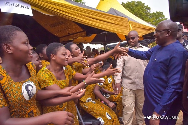 Dr Mahamudu Bawumia (right), the Vice-President, exchanging pleasantries with some of the students