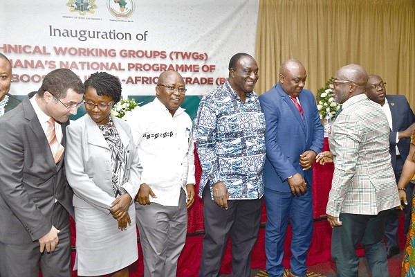  Mr Alan Kyerematen (4th from left) interacting with Mr Yoofi Grant (right), CEO of the Ghana Investment Promotion Centre and member of the Trade Policy Working Group. With them are Mr Carlos Ahenkorah (2nd right), Deputy Minister, Trade and Industry, and some members of the group. Picture: EBOW HANSON