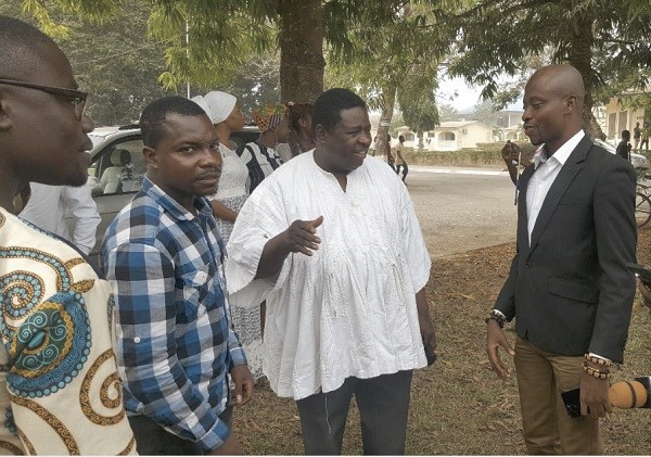 Dr Abu Sakara (middle) interacting with Mr Albert Mensah (right) the Founder of CEBSAR and others