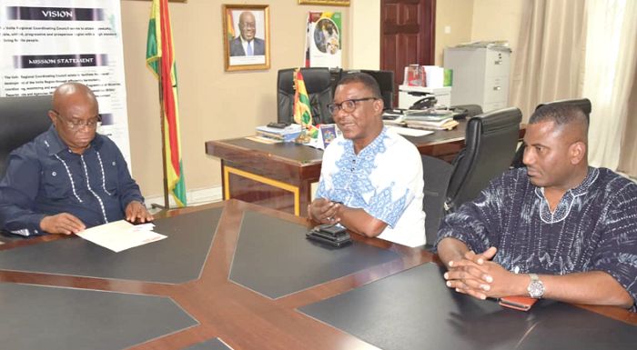  Mr Kobby Asmah (middle) and Mr Franklin Sowa (right) in a discussion with Dr Archibald Yao Letsa (left)