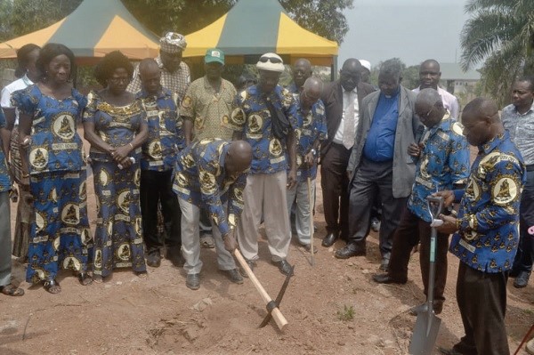 Mr Kojo Ansah Mbeah, the chairman of the association, cutting the sod for the commencement of the project while other executive members and guests look on