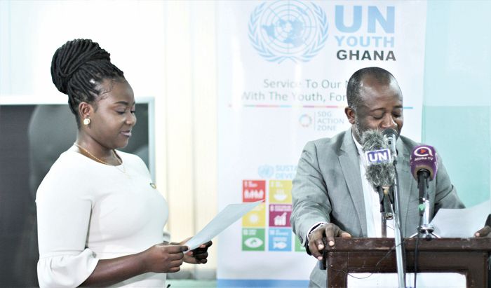 Lawyer Kwadwo Amankwa (Right) swearing in the New UN Youth Ghana Country Head, Miss Rita Siba Opare (left) 