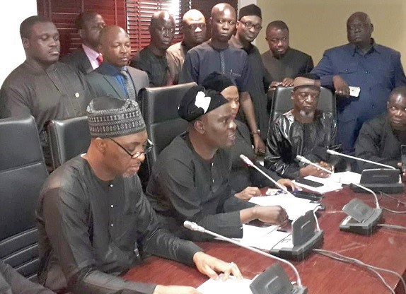 Mr Haruna Iddrisu (2nd left) addressing the media