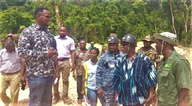 Mr Stephen Asamoah Duah (left) explaining a point to Mr Kwaku Asomah-Cheremeh (in smock) during the tour of the Fure Forest Reserve